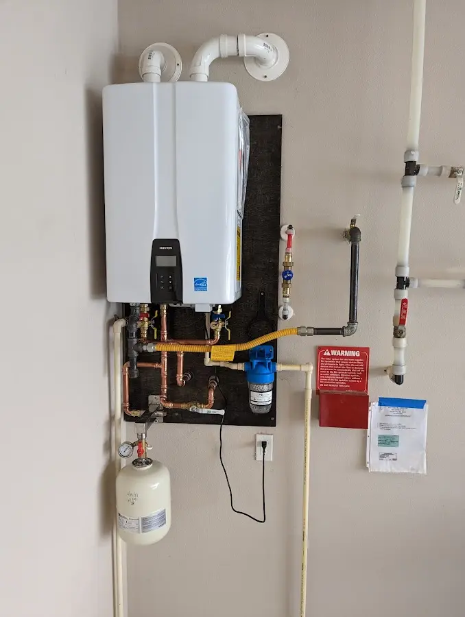 Professional plumber installing copper piping in a Pacific home